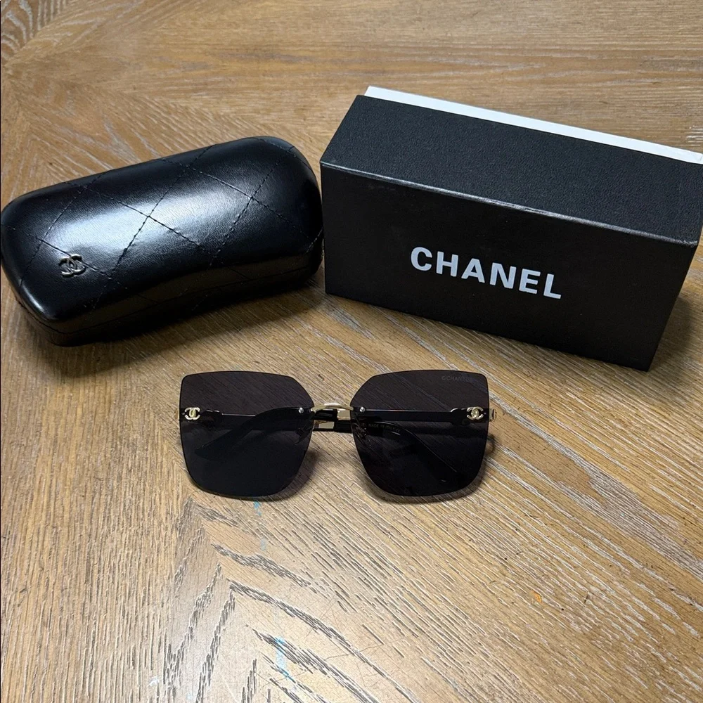 CHANEL Rimless Square Sunglasses in Black with Gold Details